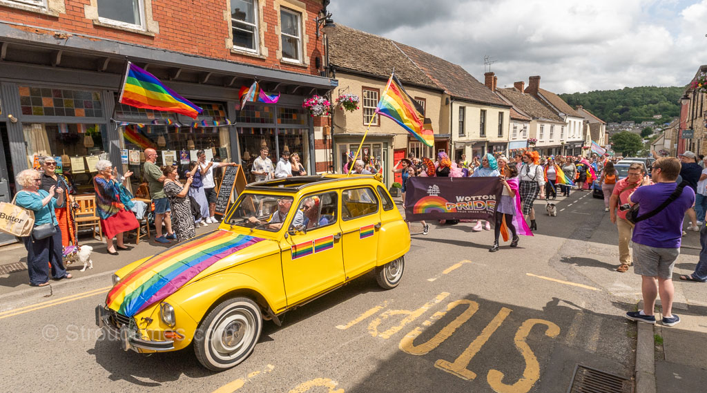 A riot of rainbow colour and a parade of more than 100 people, led by a vintage Citroen 2CV car bedecked with rainbow flags, as well-wishers lined Long Street in Wotton-under-Edge today, Saturday. Wotton Pride 28 | Pride parade fills town with a riot of rainbow colour
