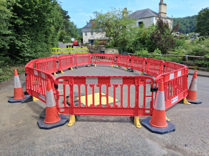 Sinkhole shuts down road through village