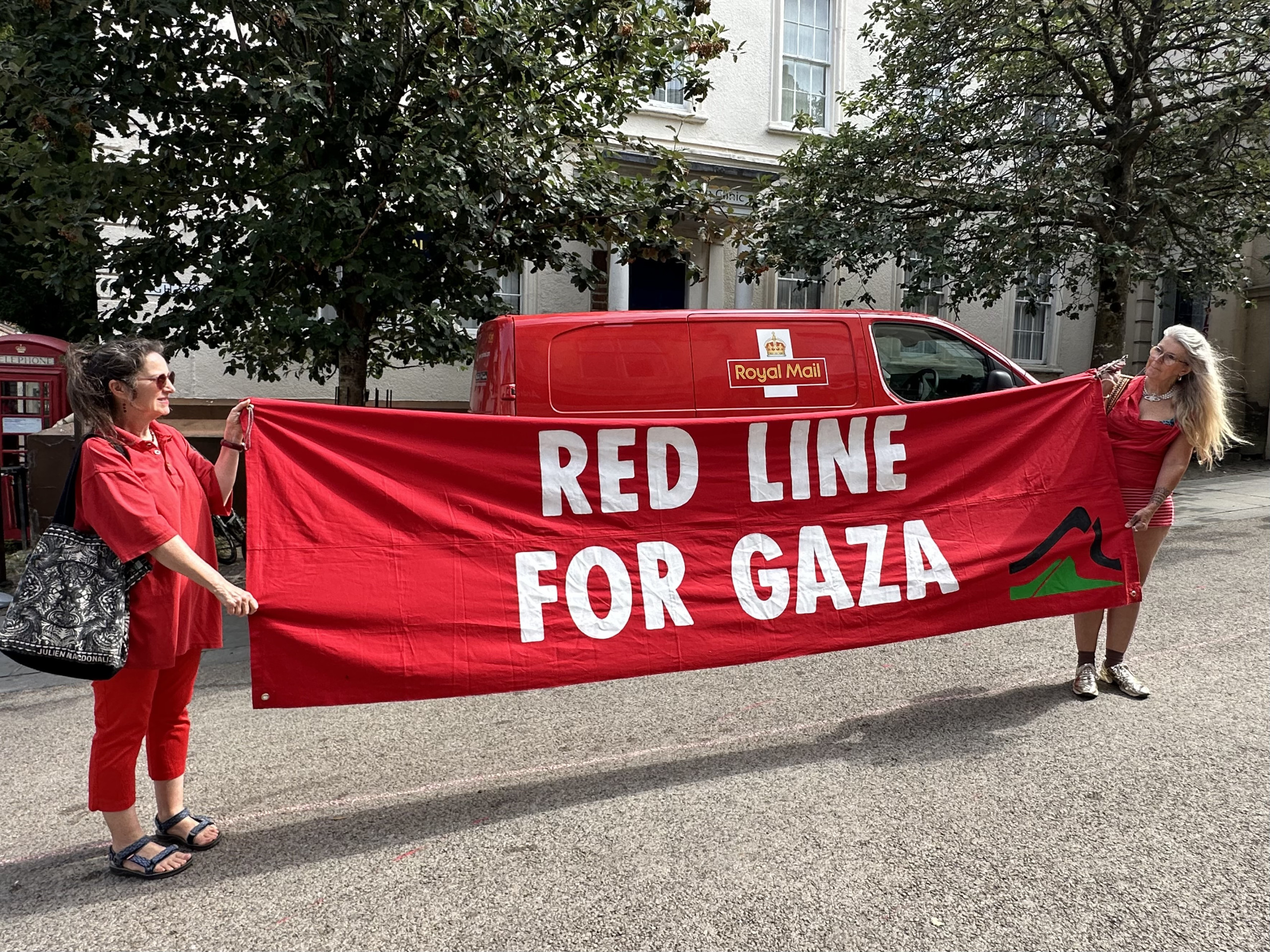 5.Banner RedLineForGaza ClareH ValerieL Copyright Deborah Roberts IMG 9089 scaled | In pictures: Stroud joins nationwide Red Line for Gaza demonstration